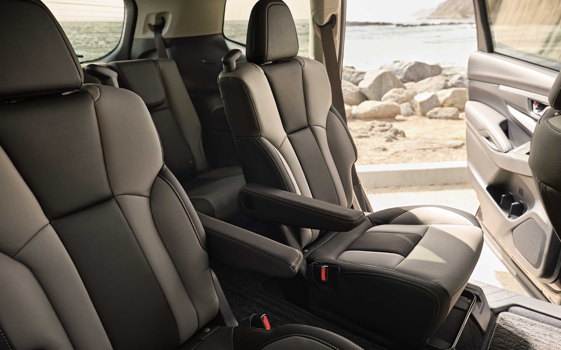 A view of the rear seats showing the gray StarTex Upholstery inside the Subaru Ascent Onyx Edition.