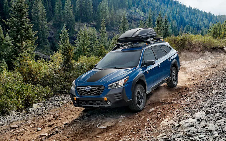 2022 Outback Wilderness driving down a rocky incline.